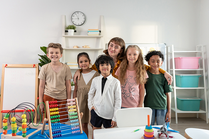 Diverse group of children in a supportive ABA therapy classroom in Sherman Oaks, developing social skills and learning through structured autism intervention.